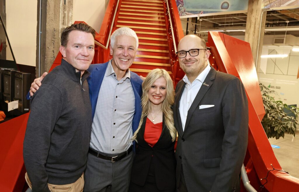 From left, Nick Quain, vice-president of venture and entrepreneurship at Invest Ottawa, with former president and CEO Michael Tremblay, interim president and CEO Sonya Shorey, and vice-president of global expansion, Jens-Michael Schaal, at a reception held at Bayview Yards to honour Tremblay's leadership of the organization. Photo by Caroline Phillips