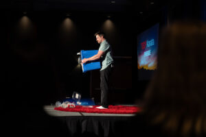 Geoffrey MacKay poured out his recycling onto the stage to open his speech about ending garbage.