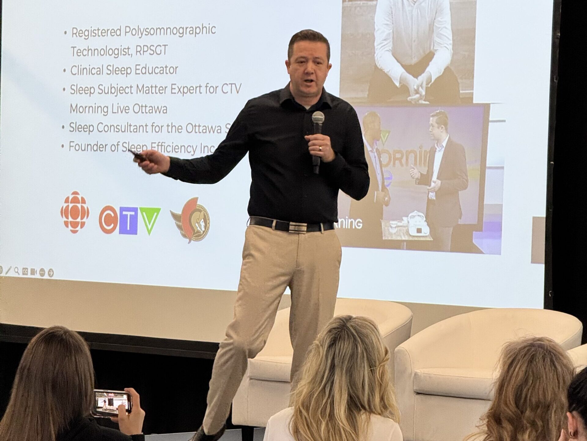 Andrew Holmes presents on Sleep Efficiency to an audience.