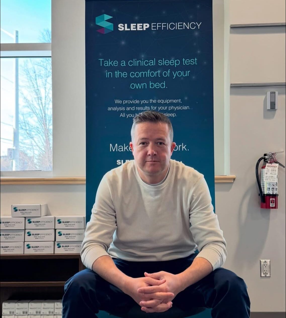 Andrew Holmes headshot in front of a Sleep Efficiency banner.