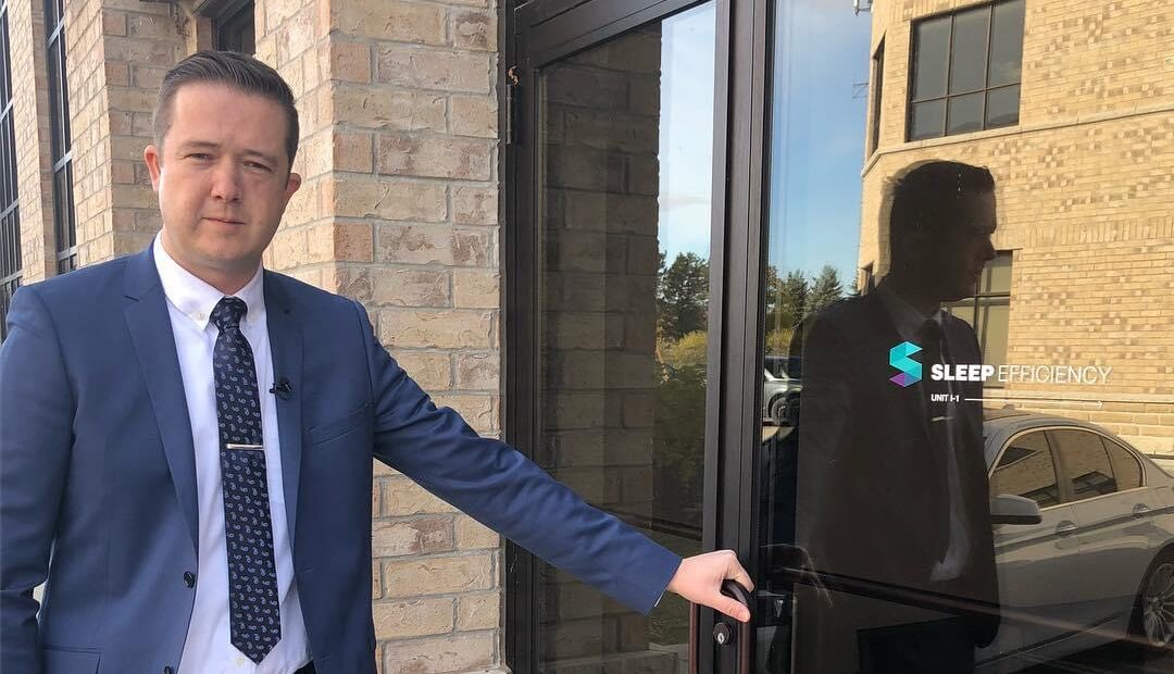 Andrew Holmes entering the office for Sleep Efficiency.