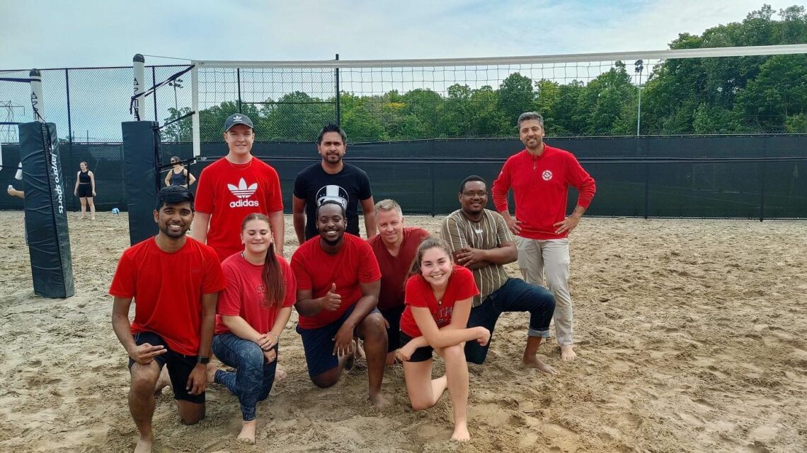 One of the teams in the Kanata North Volleyball League poses on the sandy Richraft Recreation Center court after a win.