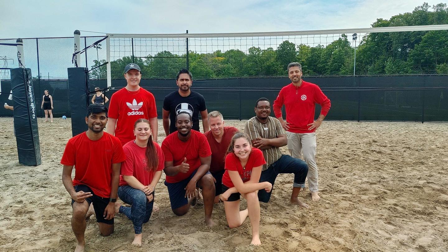 One of the teams in the Kanata North Volleyball League poses on the sandy Richraft Recreation Center court after a win.