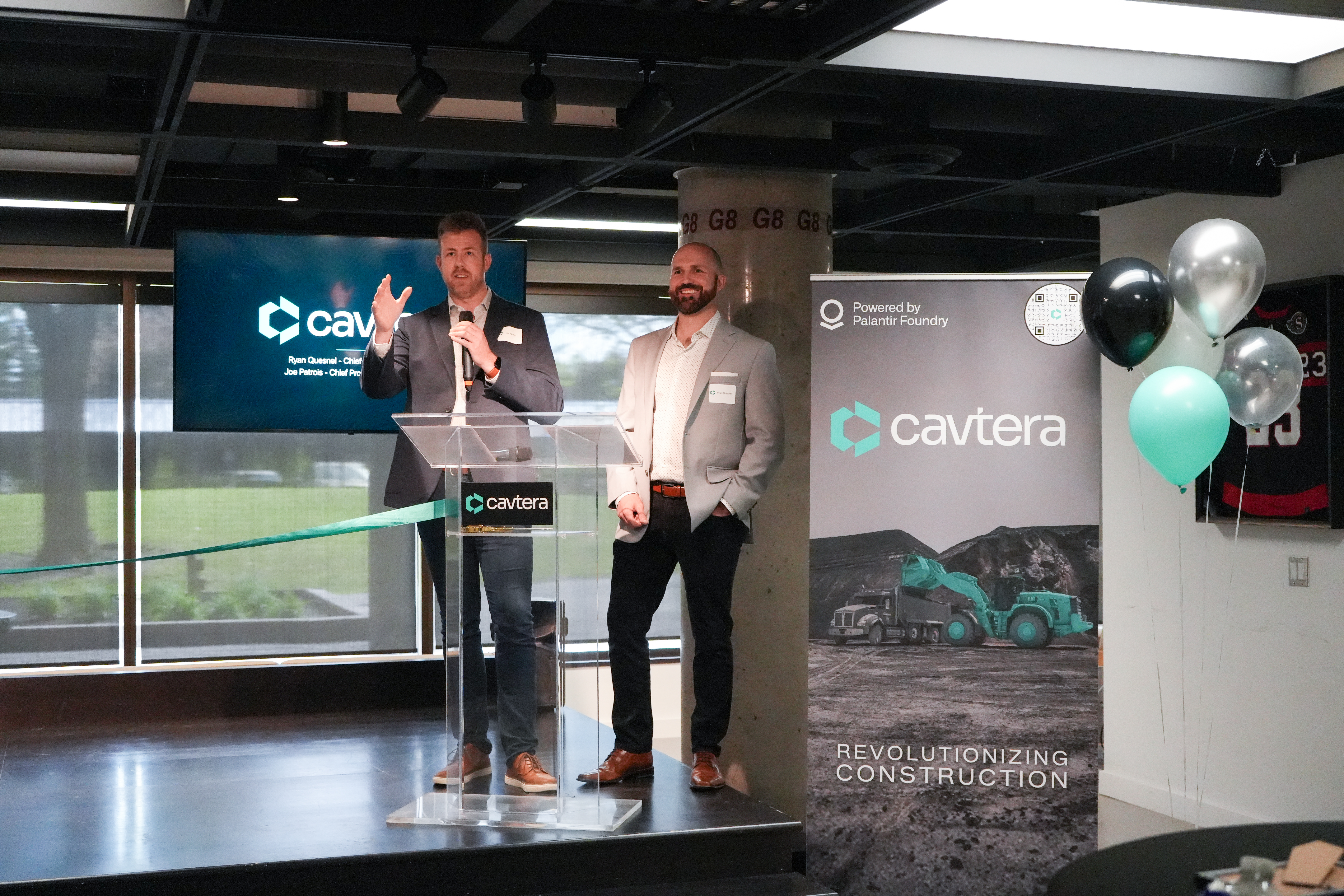 Leaders from Cavtera on stage at Hub350 in Kanata North.